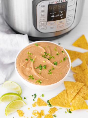 Photo of a bowl of Instant Pot refried beans with an Instant Pot