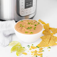 Square photo of a bowl of Instant Pot refried beans