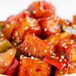 Side photo of a plate of sweet and sour tofu witht the words sweet and sour tofu