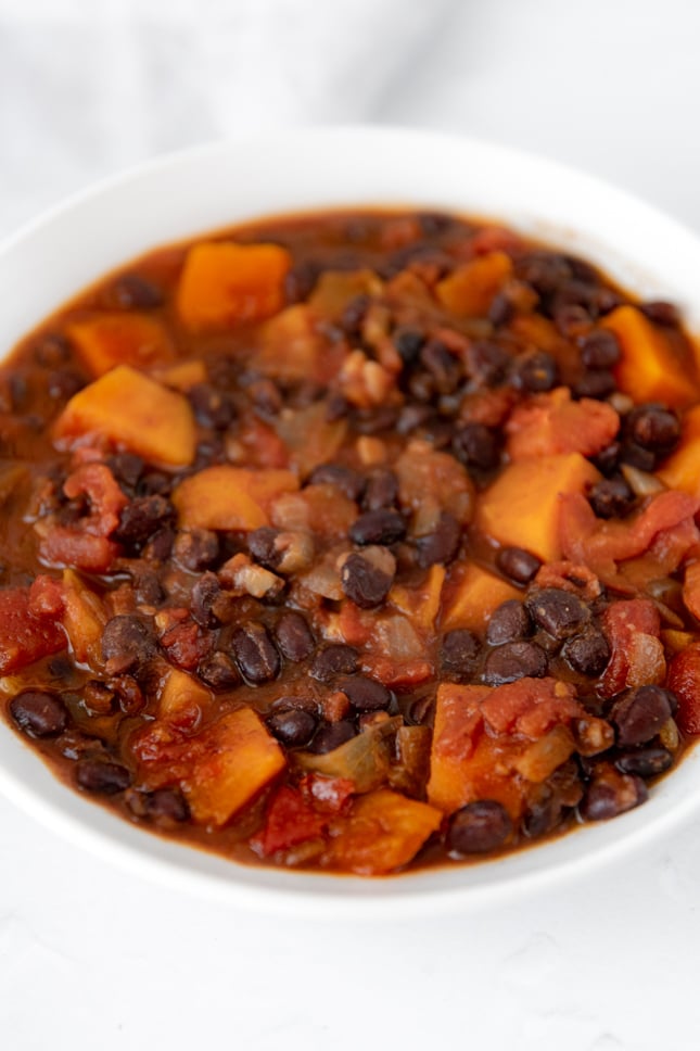 Close-up photo of a bowl of sweet potato black bean chili
