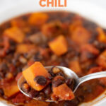 Close-up photo of a bowl of sweet potato black bean chili with the words sweet potato black bean chili
