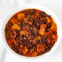 Square photo of a bowl of sweet potato black bean chili