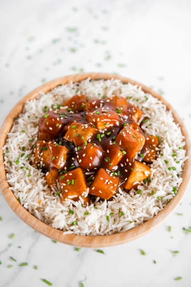 Photo of a bowl of teriyaki tofu with some rice