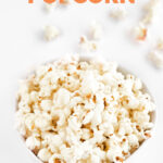 Photo of a bowl of vegan popcorn with the words vegan popcorn
