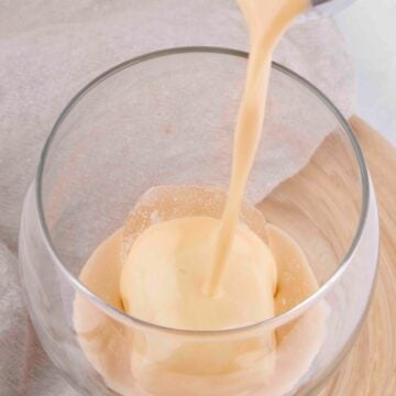 Photo of some vegan Baileys being poured into a glass