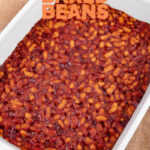 Photo of a baking dish of vegan baked beans with the words vegan baked beans