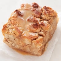 Square photo of a slice of vegan bread pudding