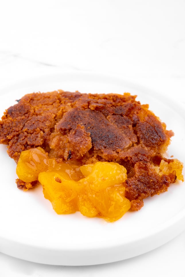 Close-up photo of some vegan peach cobbler on a plate