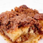 Close-up photo of a slice of vegan coffee cake with a heading