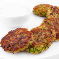 Square photo of some vegan zucchini fritters