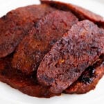 Photo of some slices of vegan bacon with a heading