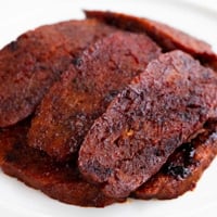 Square photo of some slices of vegan bacon
