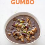 Photo of a white bowl with vegan gumbo with a heading