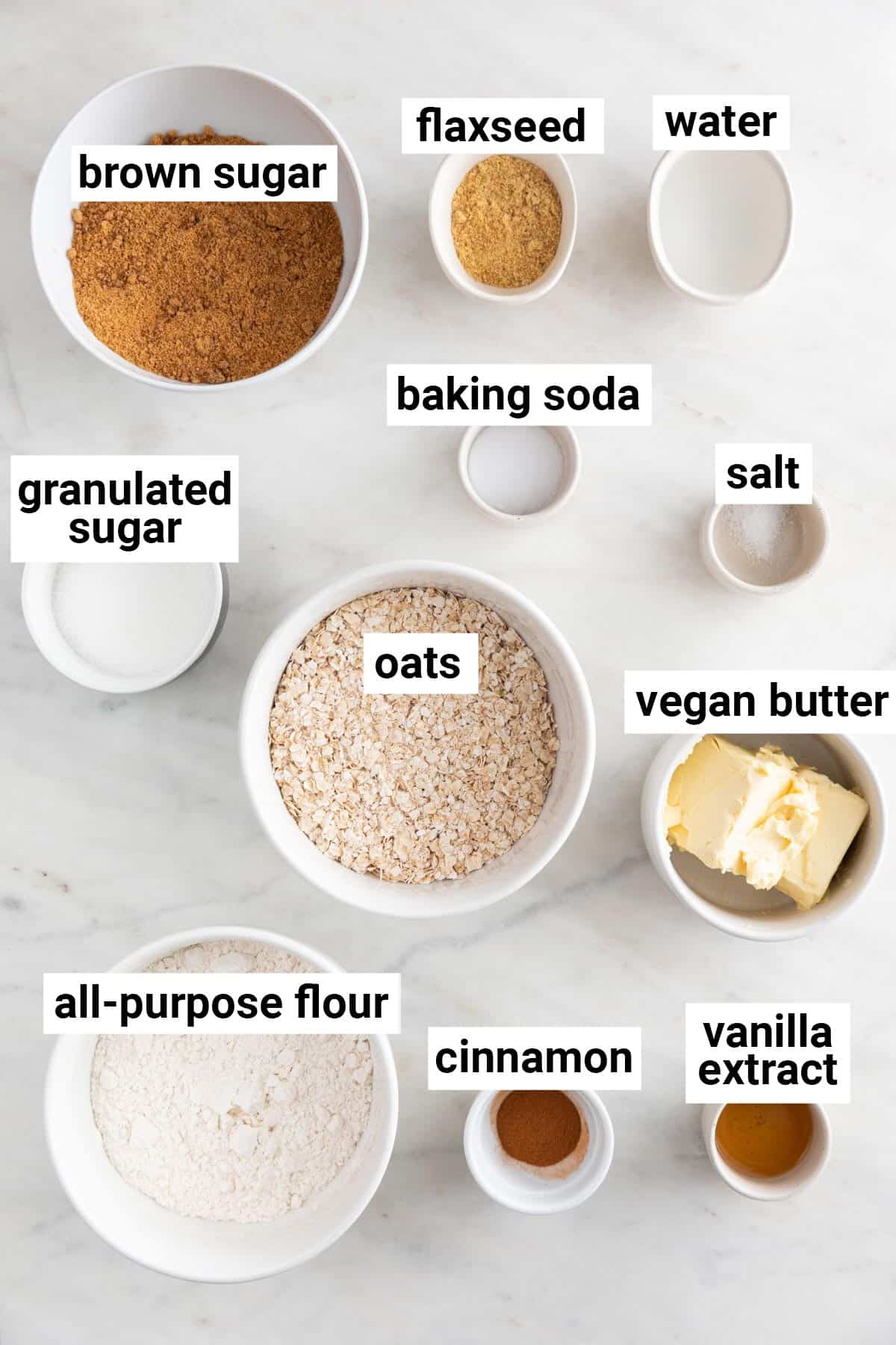 Ingredients needed to make vegan oatmeal cookies.