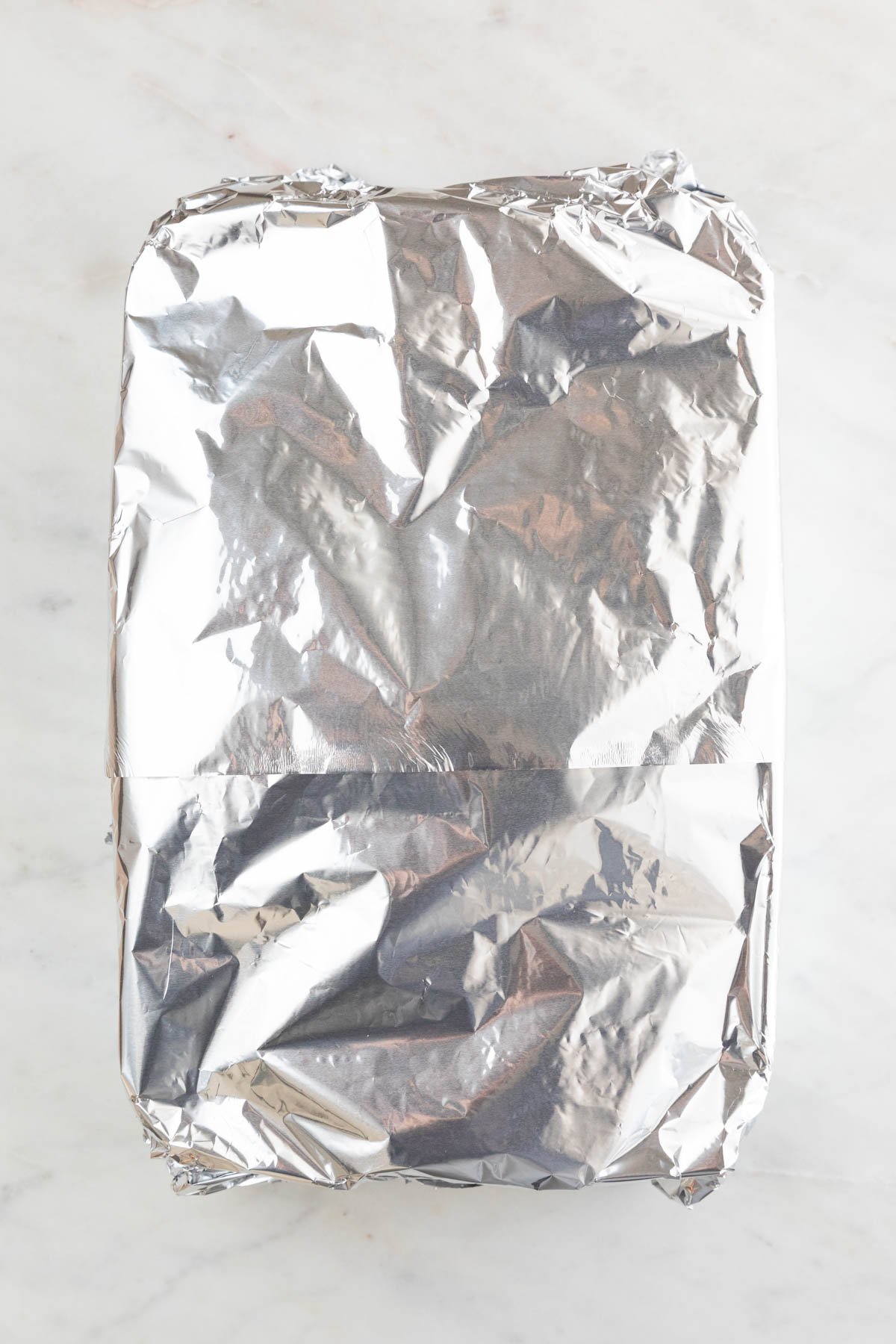A casserole dish covered with foil.
