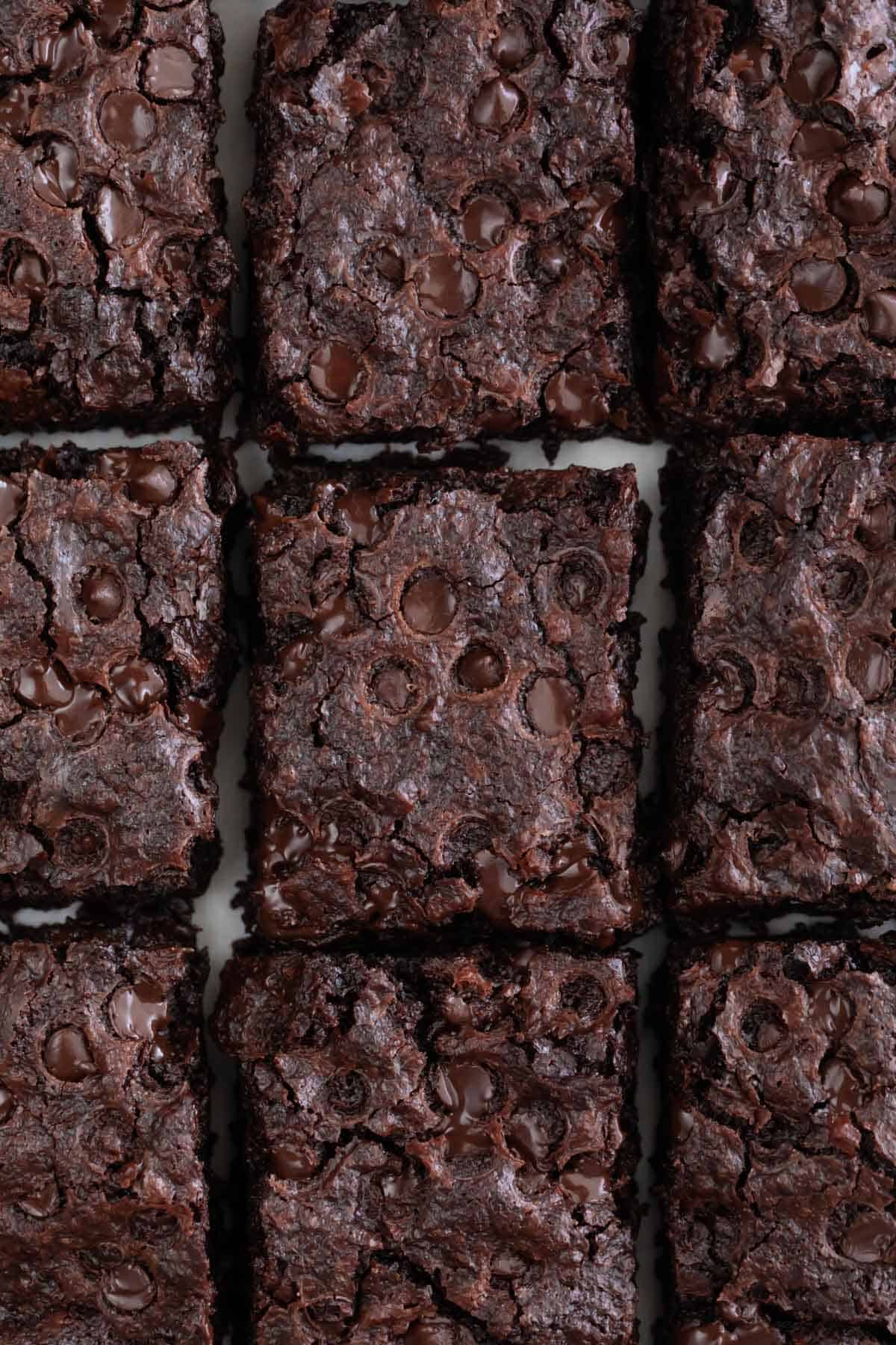 Overview of a vegan brownie cut into pieces.