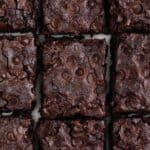 Overview of a vegan brownie cut into pieces.