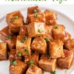 Marinated tofu cubes in a dish with some chopped chives on top and the text easy marinated tofu.