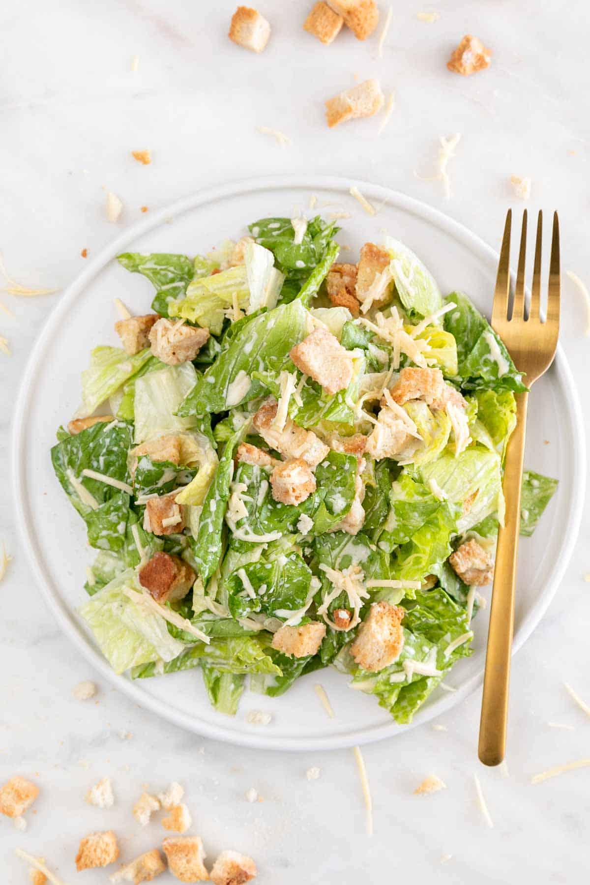 Vegan Caesar Salad on a plate with fork.