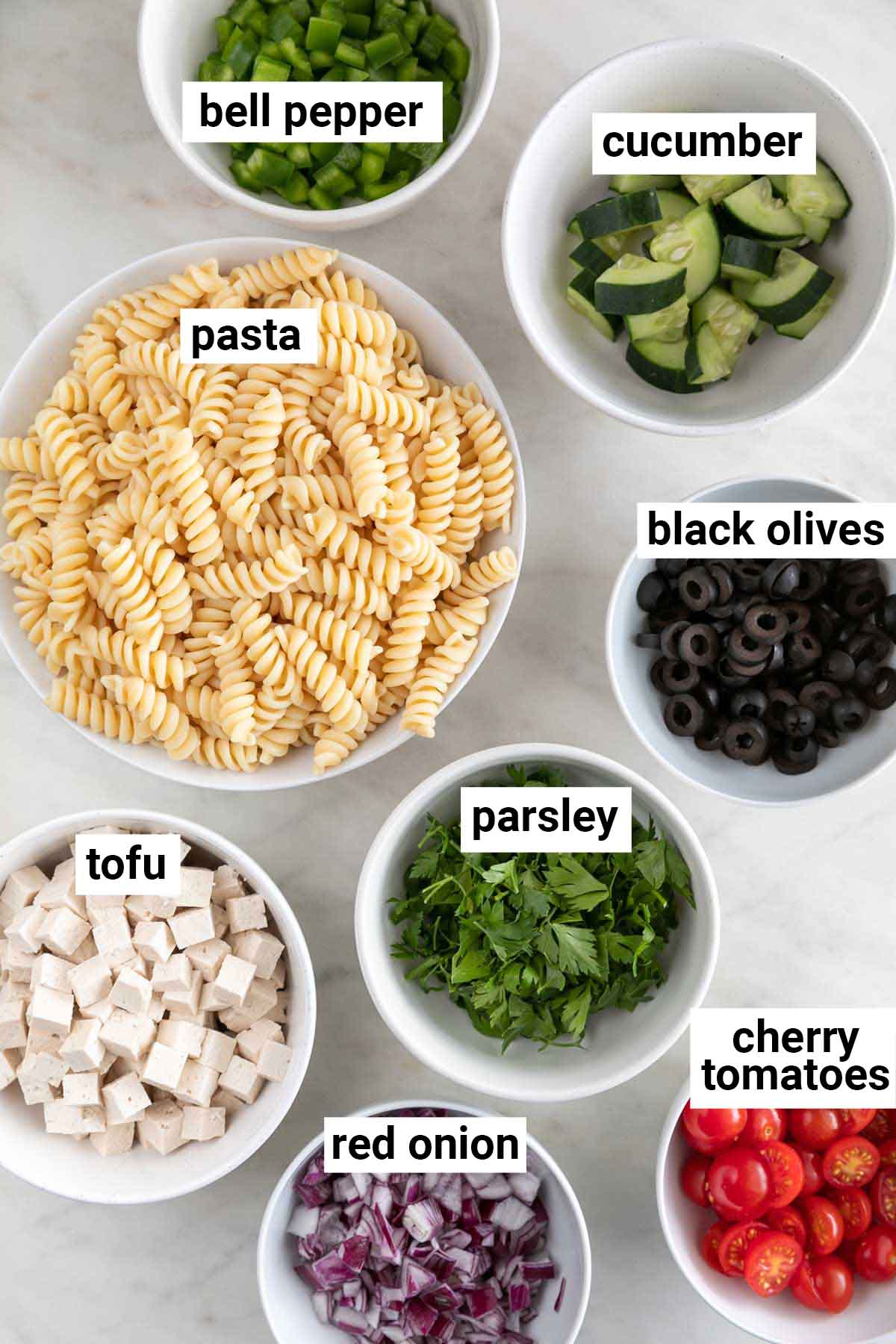 Ingredients needed to make vegan pasta salad.