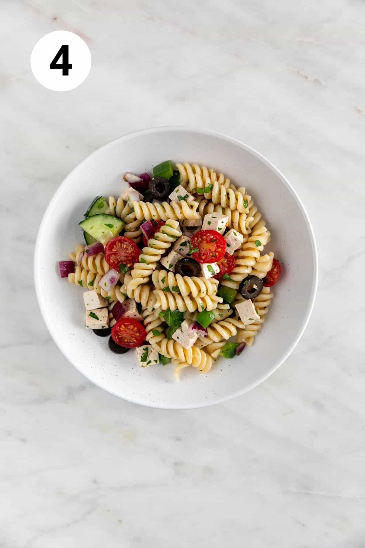 Vegan pasta salad on a white plate.