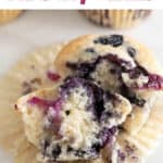 Vegan blueberry muffin, sliced open to showcase its moist, fruity center.