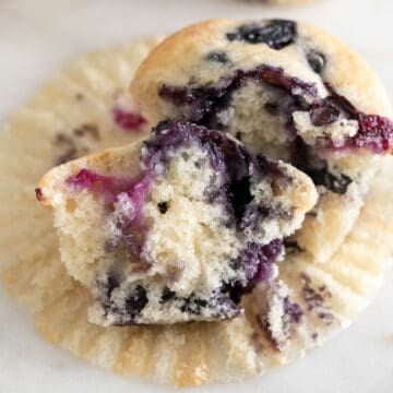 Sliced vegan blueberry muffin with a delightful, fruity center on display.