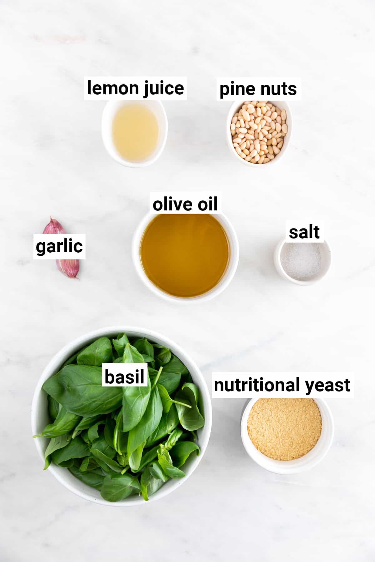 Ingredients needed to make vegan pesto.