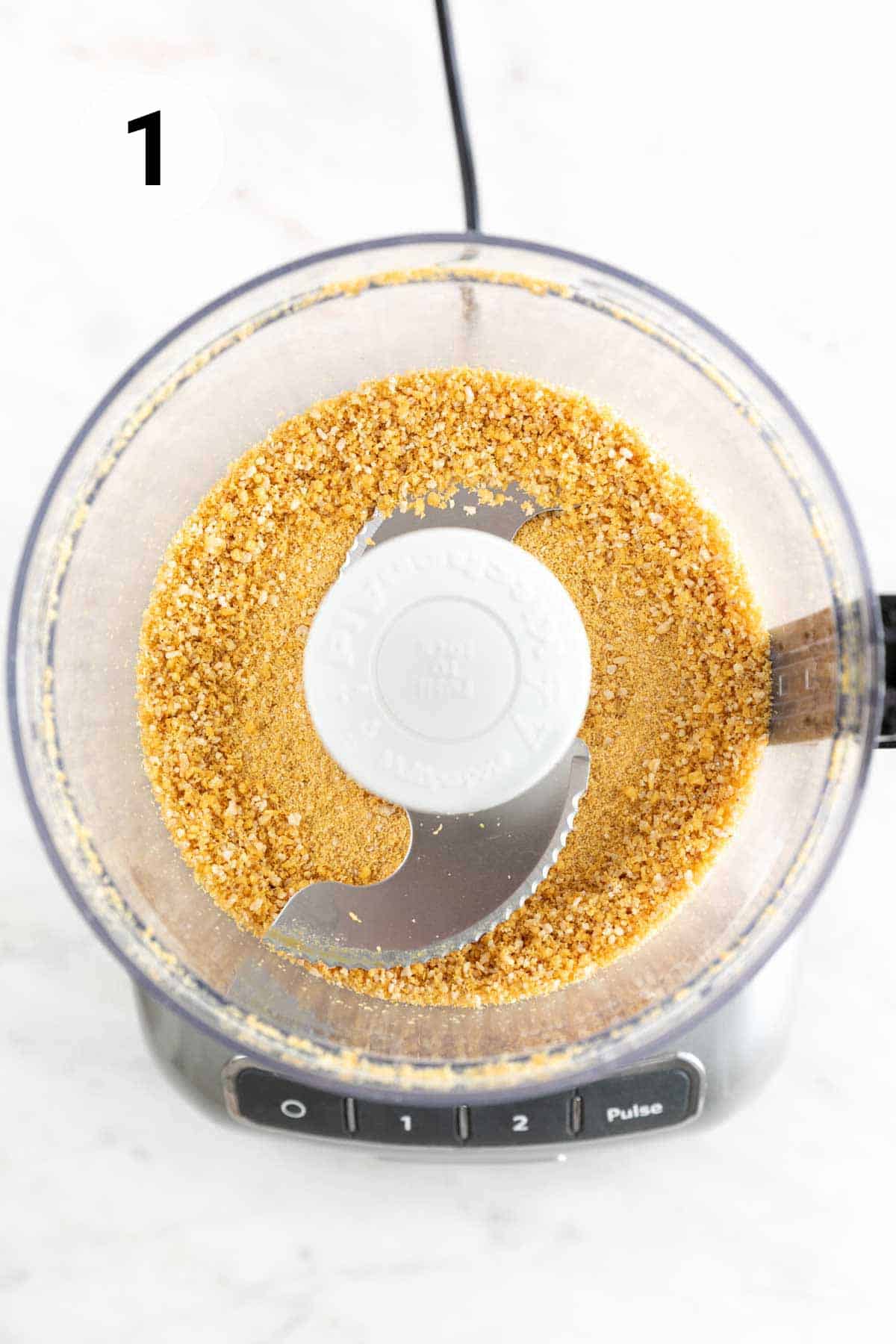 Nutritional yeast, pine nuts, garlic, and salt blended in a food processor.