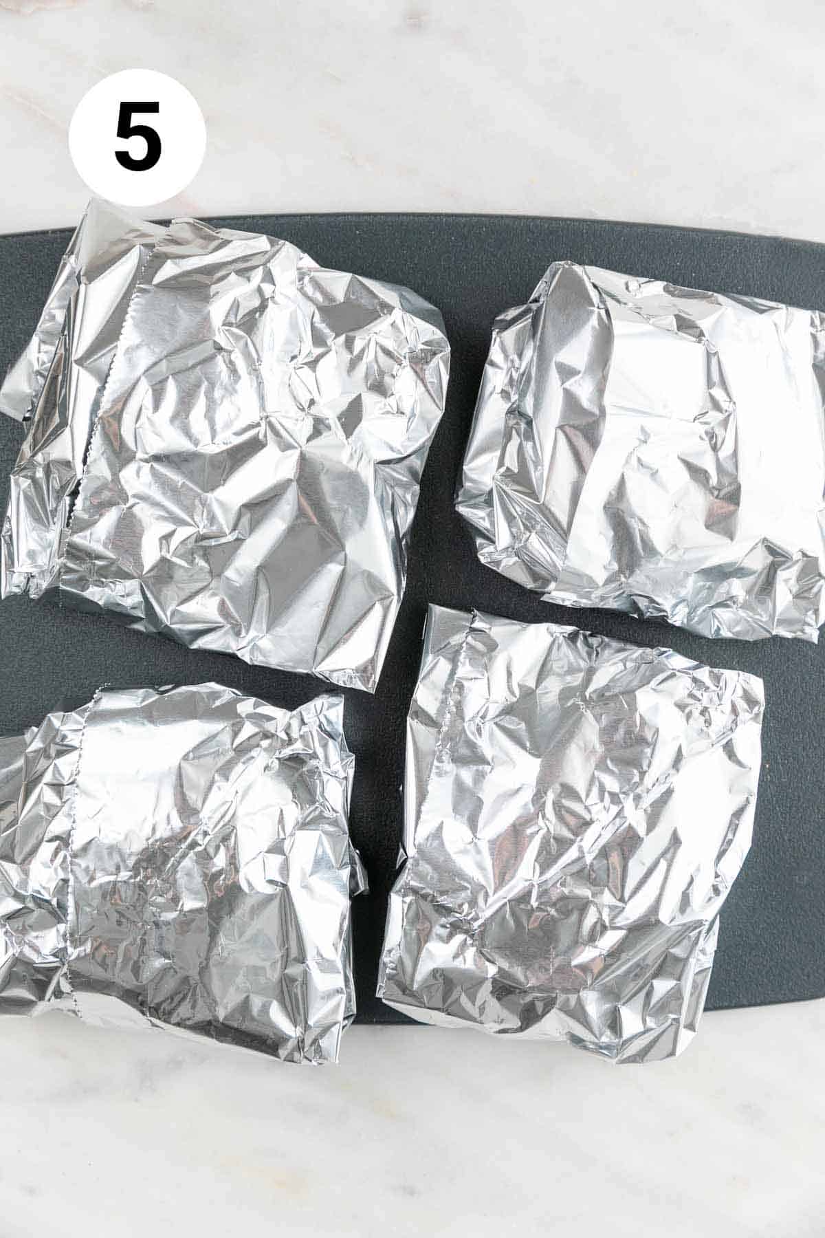 The 4 pieces wrapped loosely in aluminum foil.