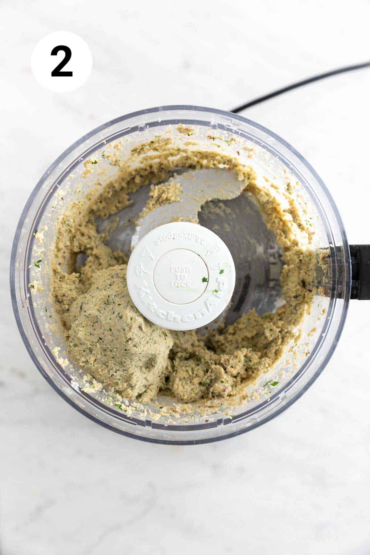 Chickpea burger blend processed in a food processor.