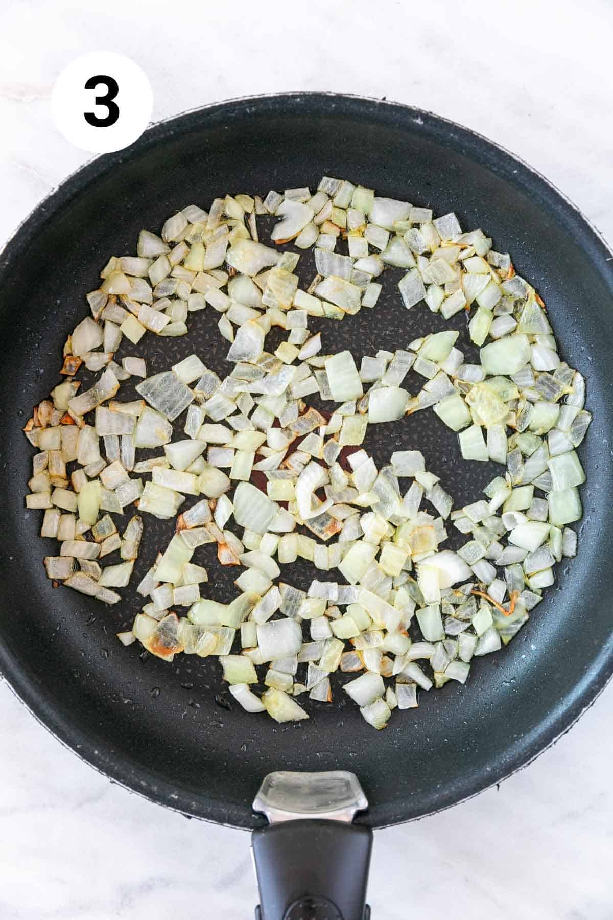 Sautéed onion in a skillet.