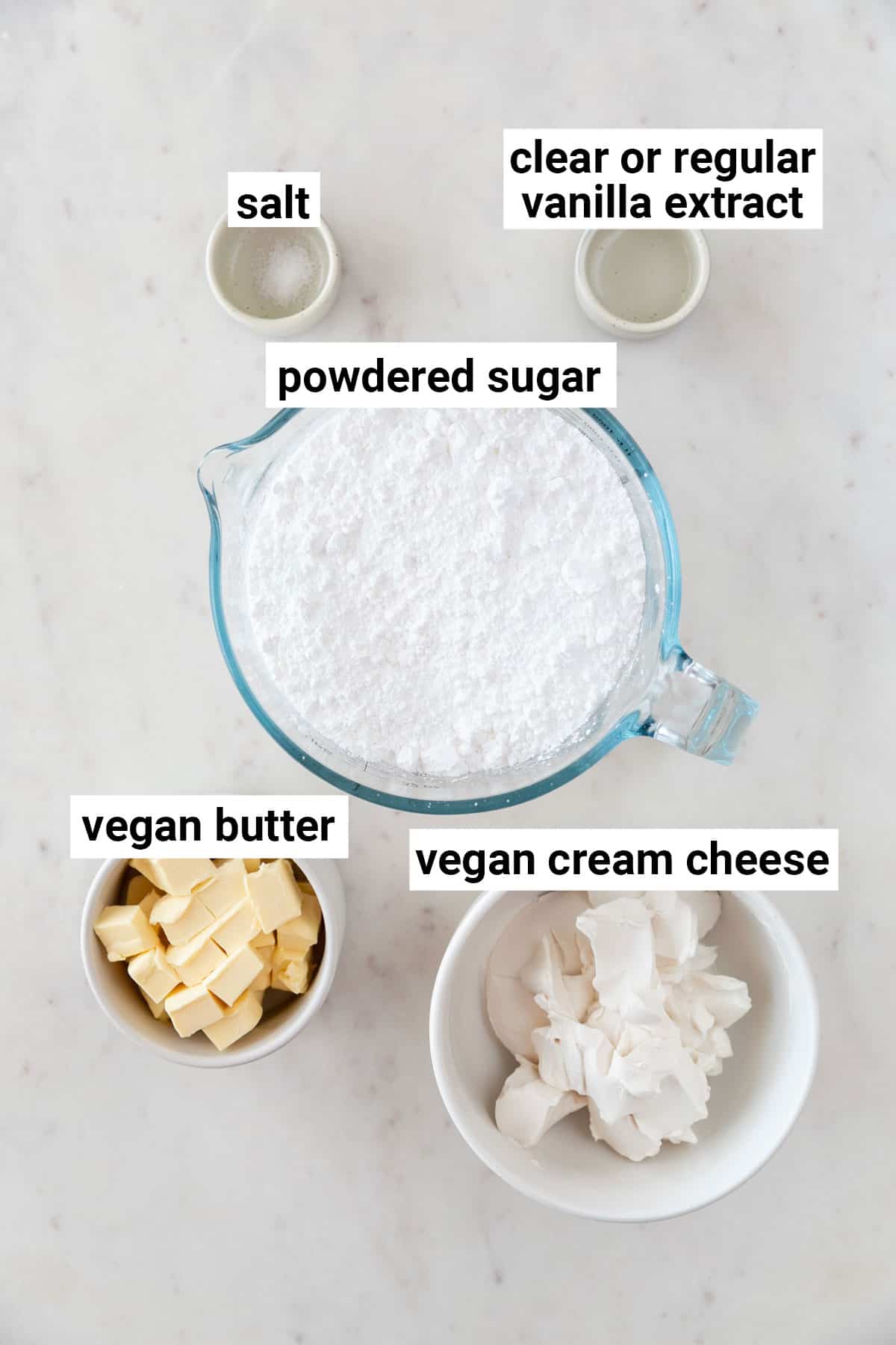 Ingredients needed to make vegan cream cheese frosting.