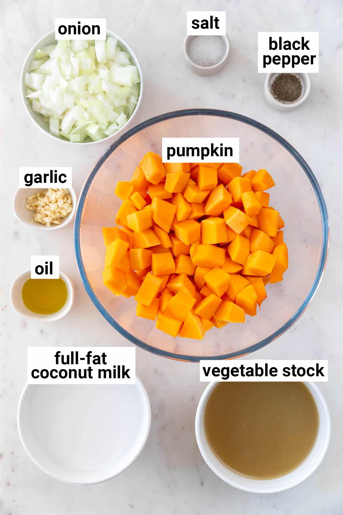 Ingredients needed to make vegan pumpkin soup.