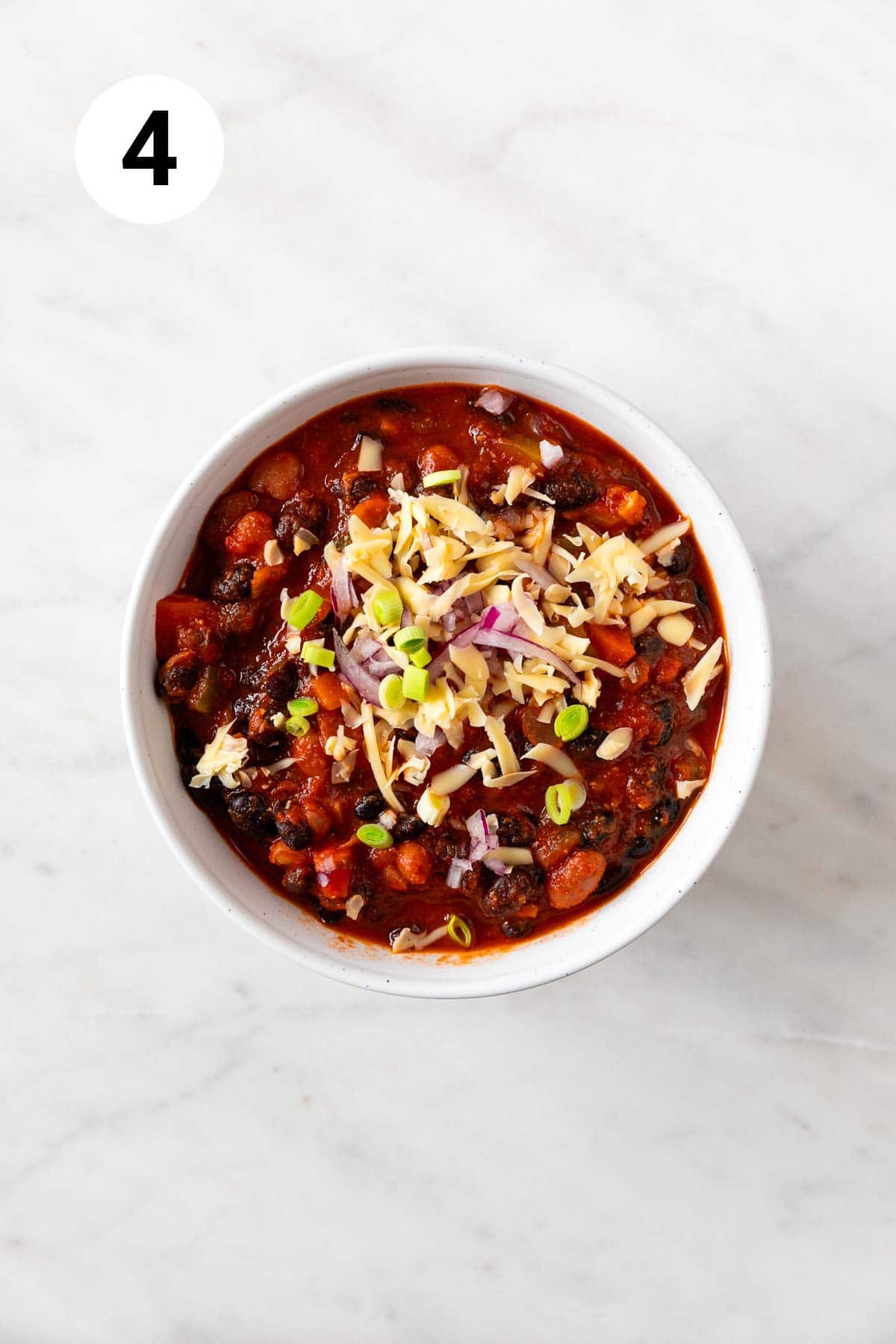 Bowl of garnished vegan chili.