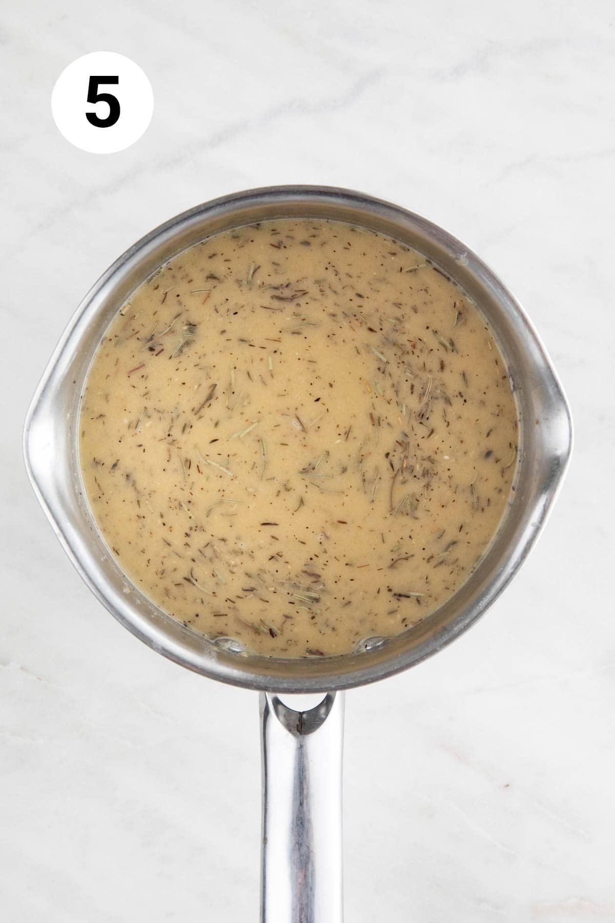 Saucepan with vegan gravy before thickening.