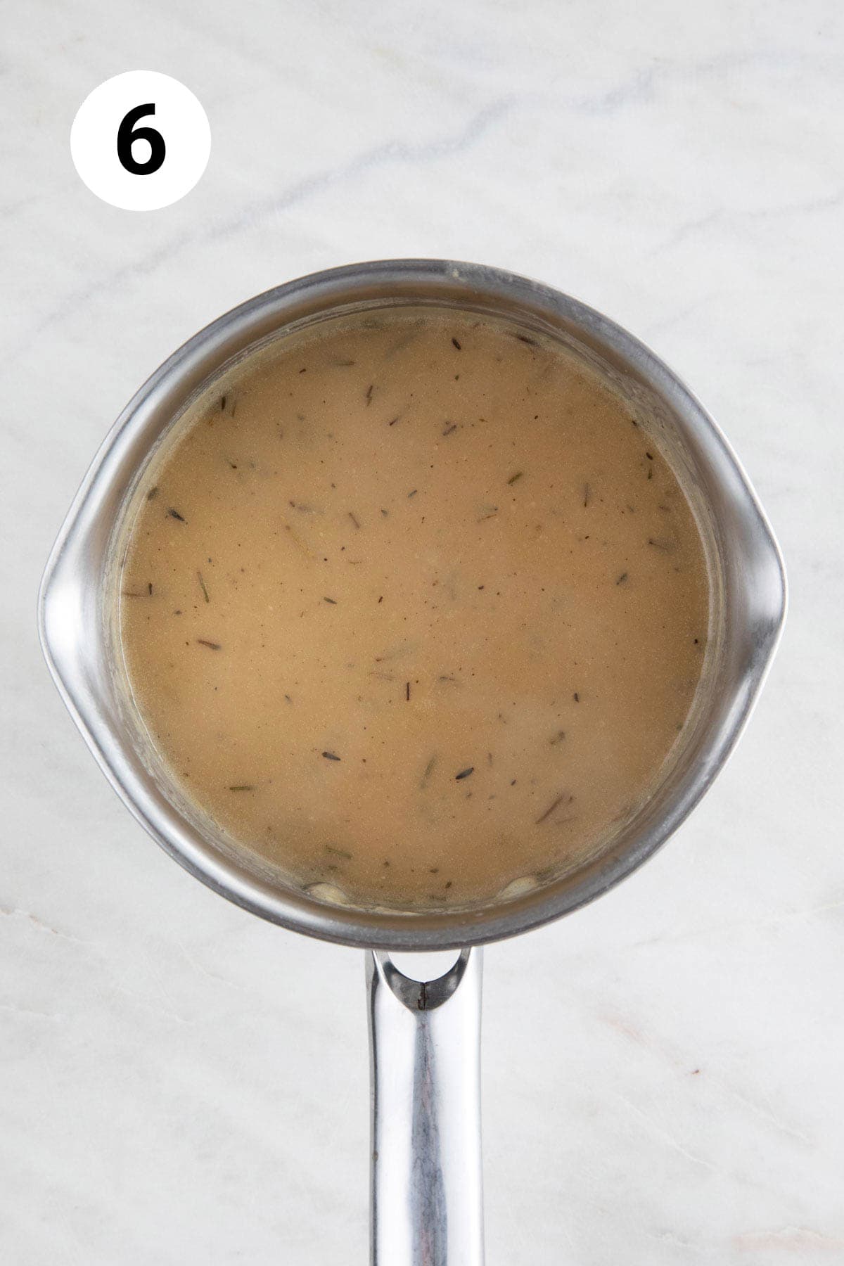 Saucepan with vegan gravy after thickening.