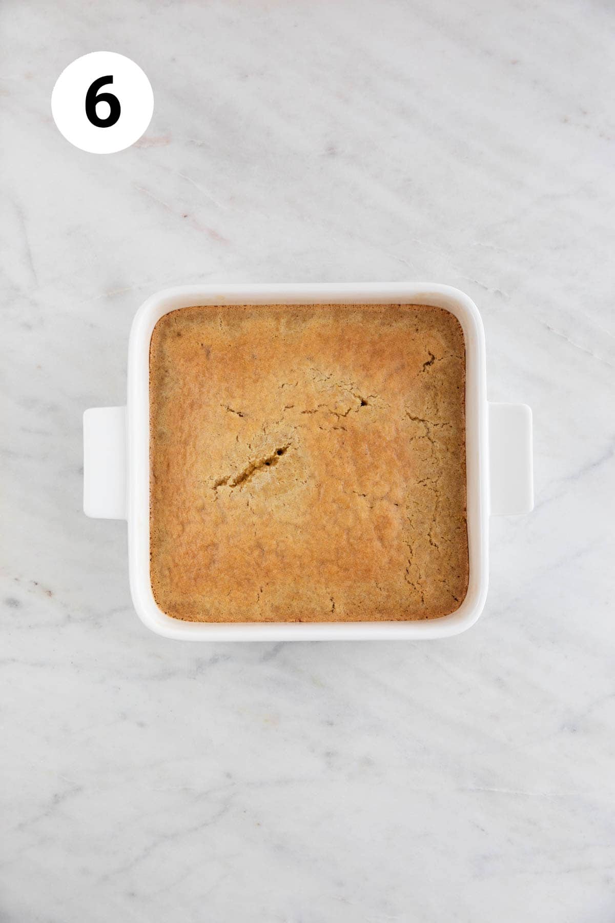 Baked vegan cornbread in a square baking dish.