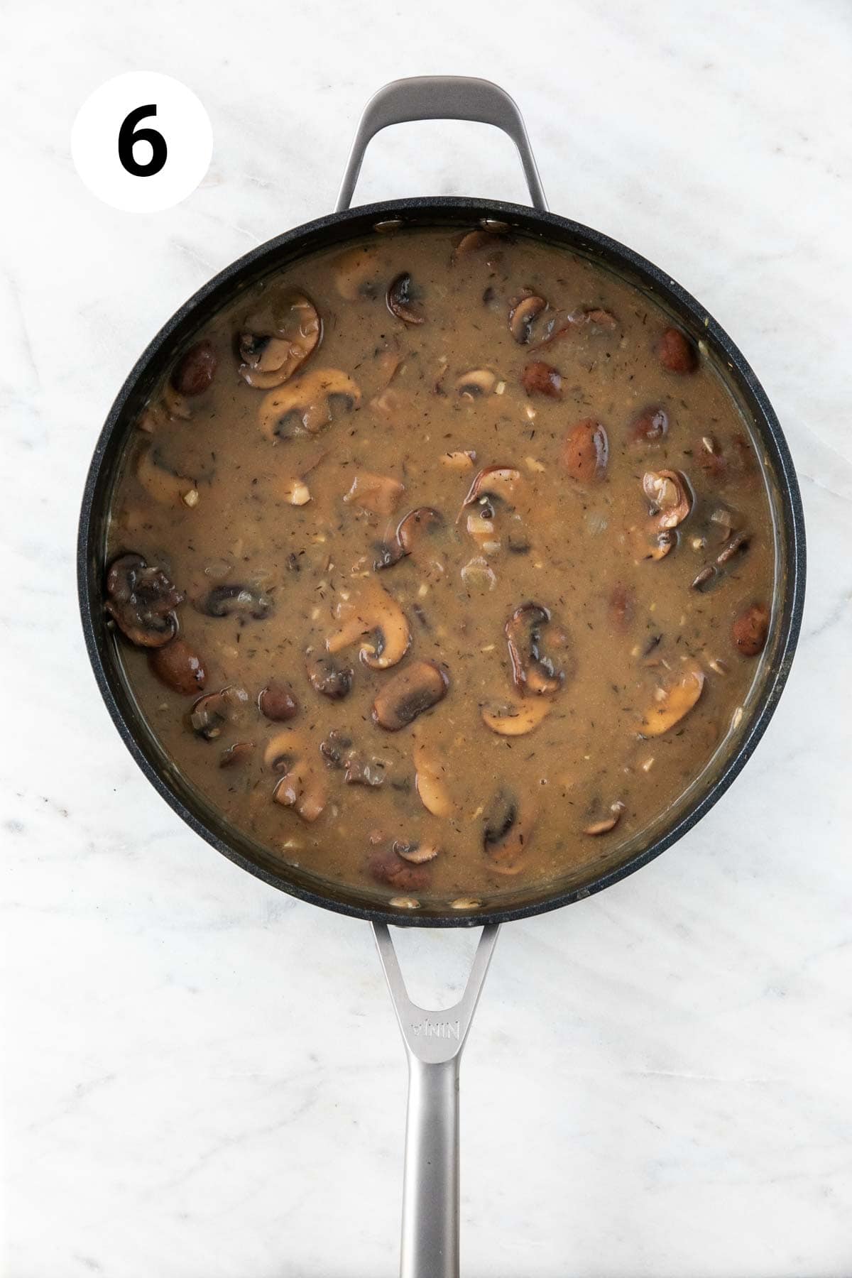Vegan mushroom gravy in a skillet.