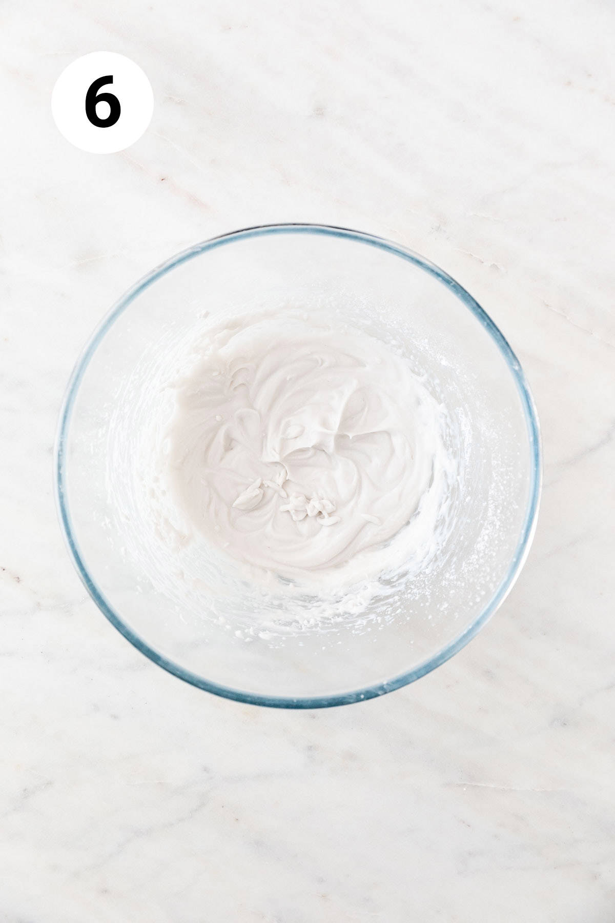Vegan whipped cream in a large mixing bowl.