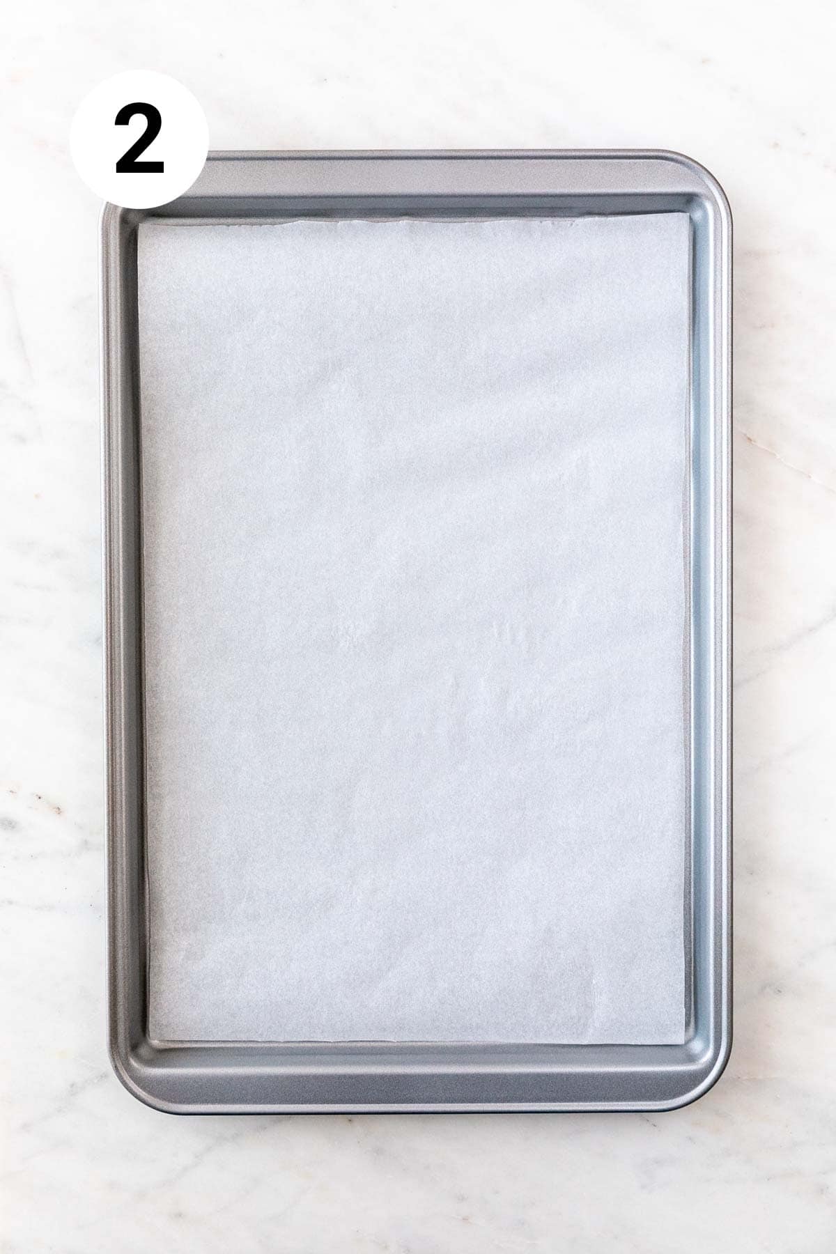 A baking sheet lined with parchment paper.