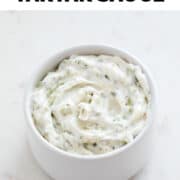 Vegan tartar sauce in small bowl on marble background.