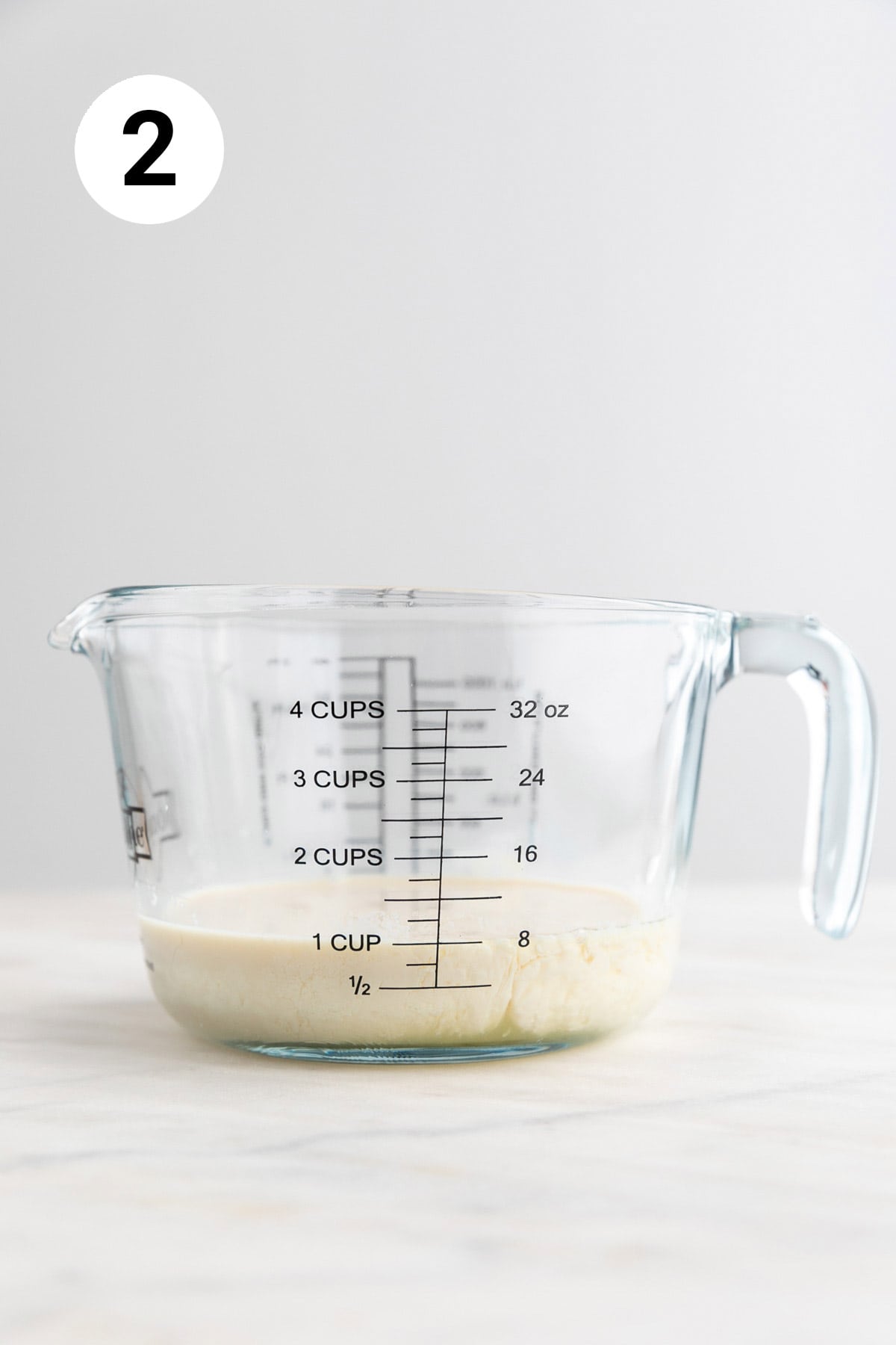 Measuring jar with vegan buttermilk.
