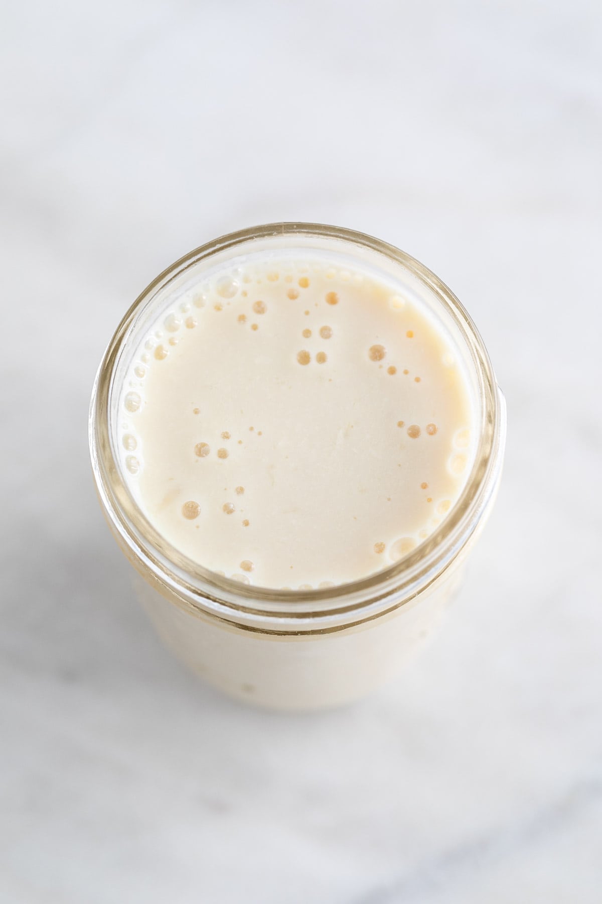 Vegan buttermilk in glass jar.