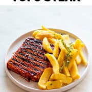 Tofu steak dish with fries and thyme.