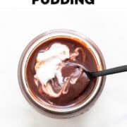 Glass of vegan chocolate pudding with spoon.