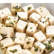 Vegan tofu feta cheese cubes in a dish.