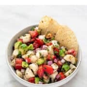 Vegan ceviche in a bowl with tortilla chips.