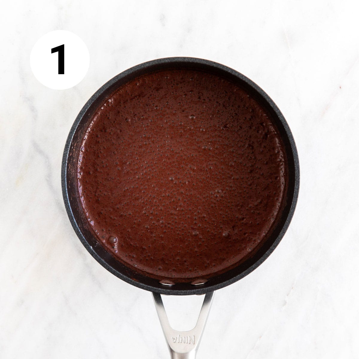 Vegan chocolate pudding ingredients mixed in a saucepan.