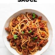 Vegan bolognese sauce mixed with spaghetti in a bowl.